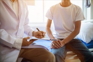 Doctor reviewing notes with patient, representing staged ratings