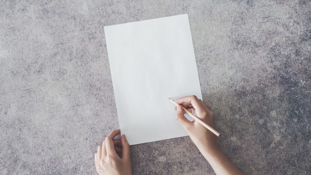 handwriting on white paper gray background for evidence submission