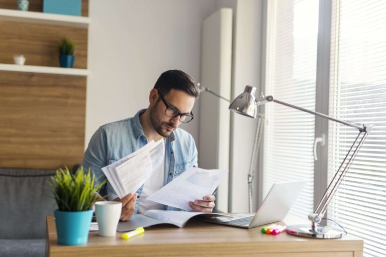 Man reading long-term definition of disability