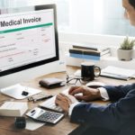person on computer looking at medical bills
