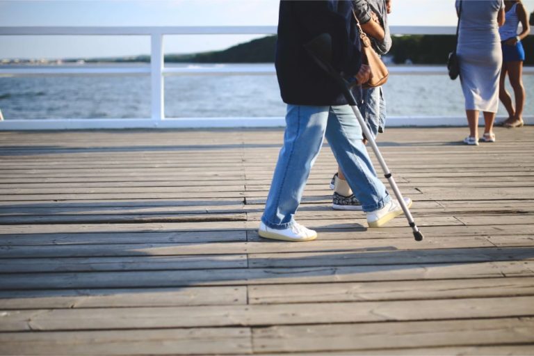 disabled person walking with cane