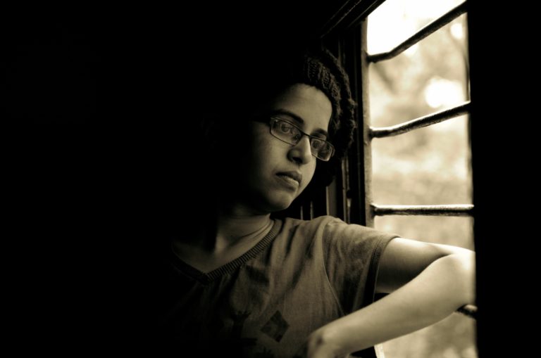 veteran looking out window experiencing chronic continuity of symptomatology
