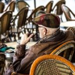 man sitting and smoking a pipe