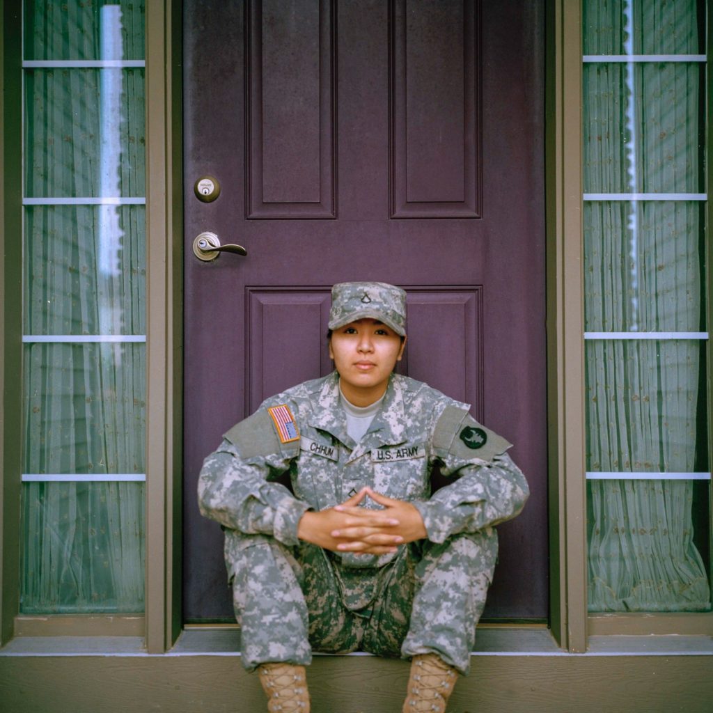 women veterans siting on stoop