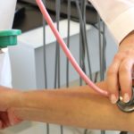 doctor arms getting hypertension reading from patient