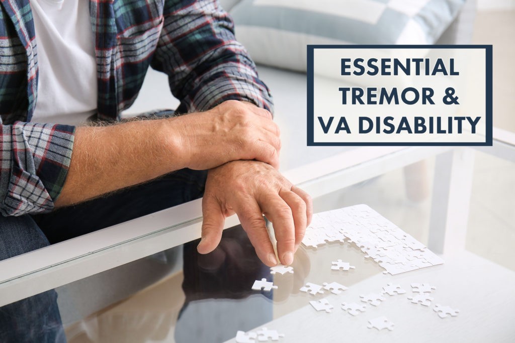 essential tremor va disability benefits overlaid on photo of man piecing a puzzle holding one wrist
