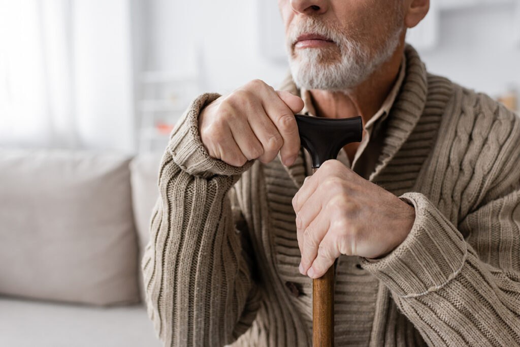 Man with cane suffering from Parkinson's disease wondering if it is a VA presumptive condition